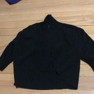 A white T-shirt and a small black cardigan